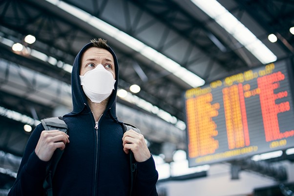 Traveller with mask at the airport